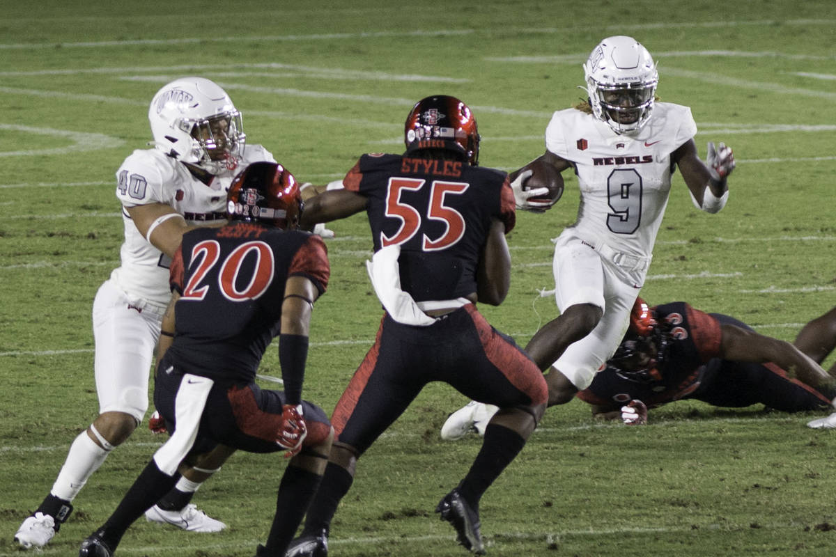 UNLV’s Tyleek Collins runs the ball back on a kickoff return during Saturday's Mountain ...