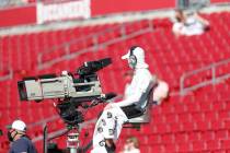 A NFL camera man works before an NFL football game, Sunday, Oct. 18, 2020, in Tampa, Fla. (AP P ...