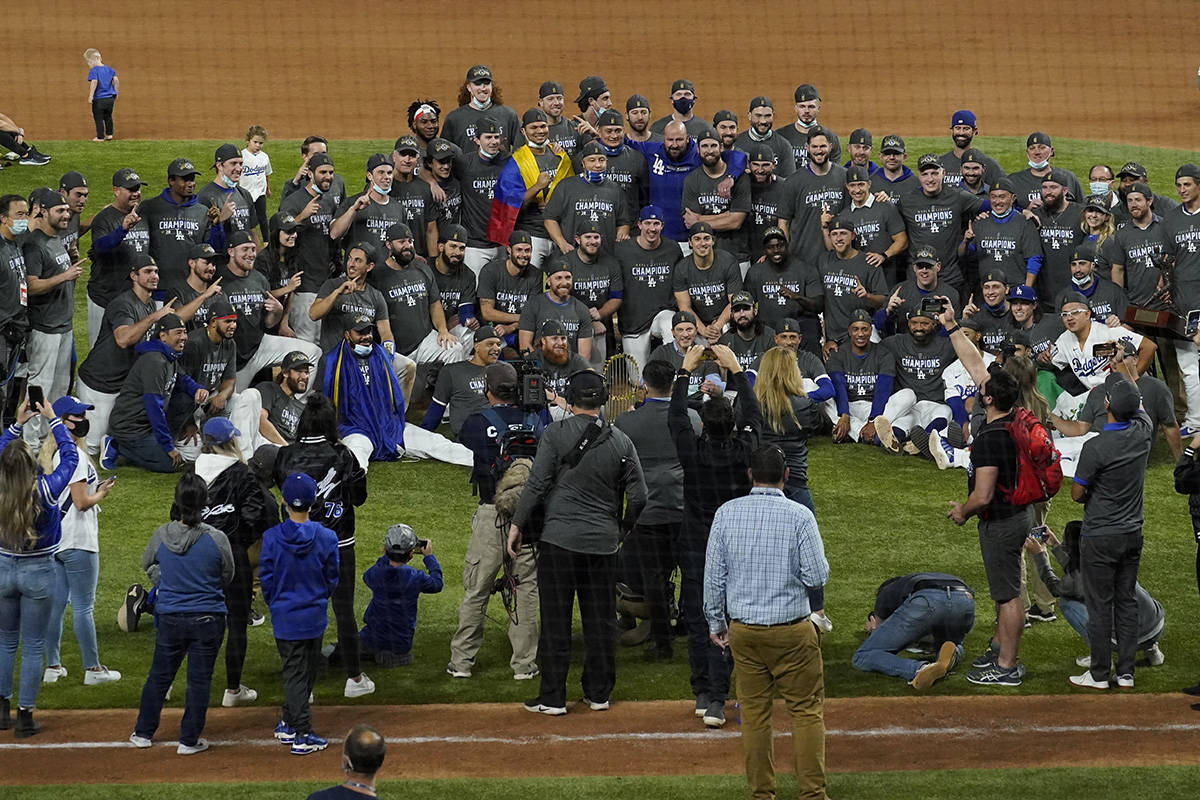 Los Angeles Dodgers celebrate after defeating the Tampa Bay Rays 3-1 to win the baseball World ...