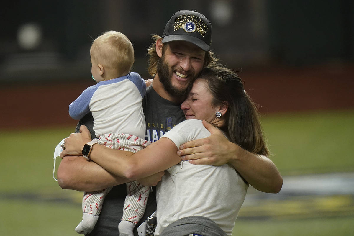 Los Angeles Dodgers starting pitcher Clayton Kershaw celebrates with family after defeating the ...
