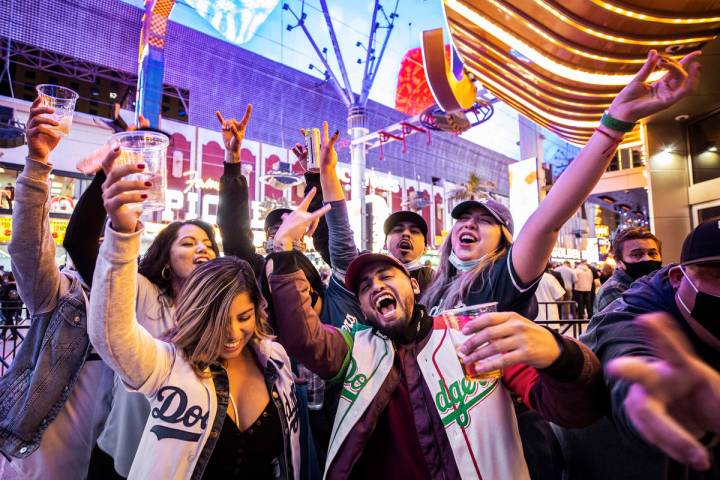 People celebrate in line as they wait to enter Circa for the first time during the resortÕ ...