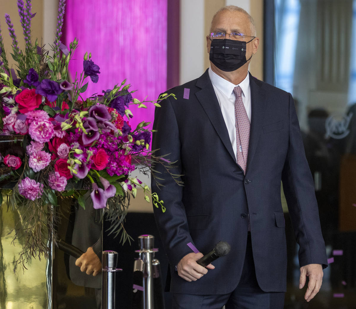 Gary Selesner, Caesars Entertainment regional president, looks on as confetti begins to rain d ...