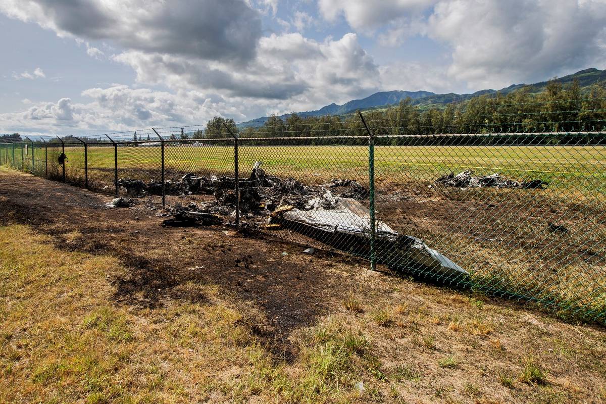 The charred remains of a skydiving plane that crash on Oahu's North Shore are shown near Waialu ...