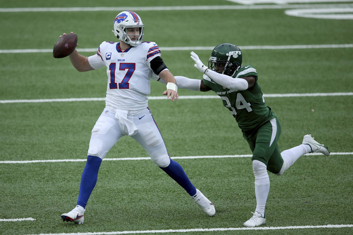 Buffalo Bills quarterback Josh Allen (17) in action against New York Jets cornerback Brian Pool ...