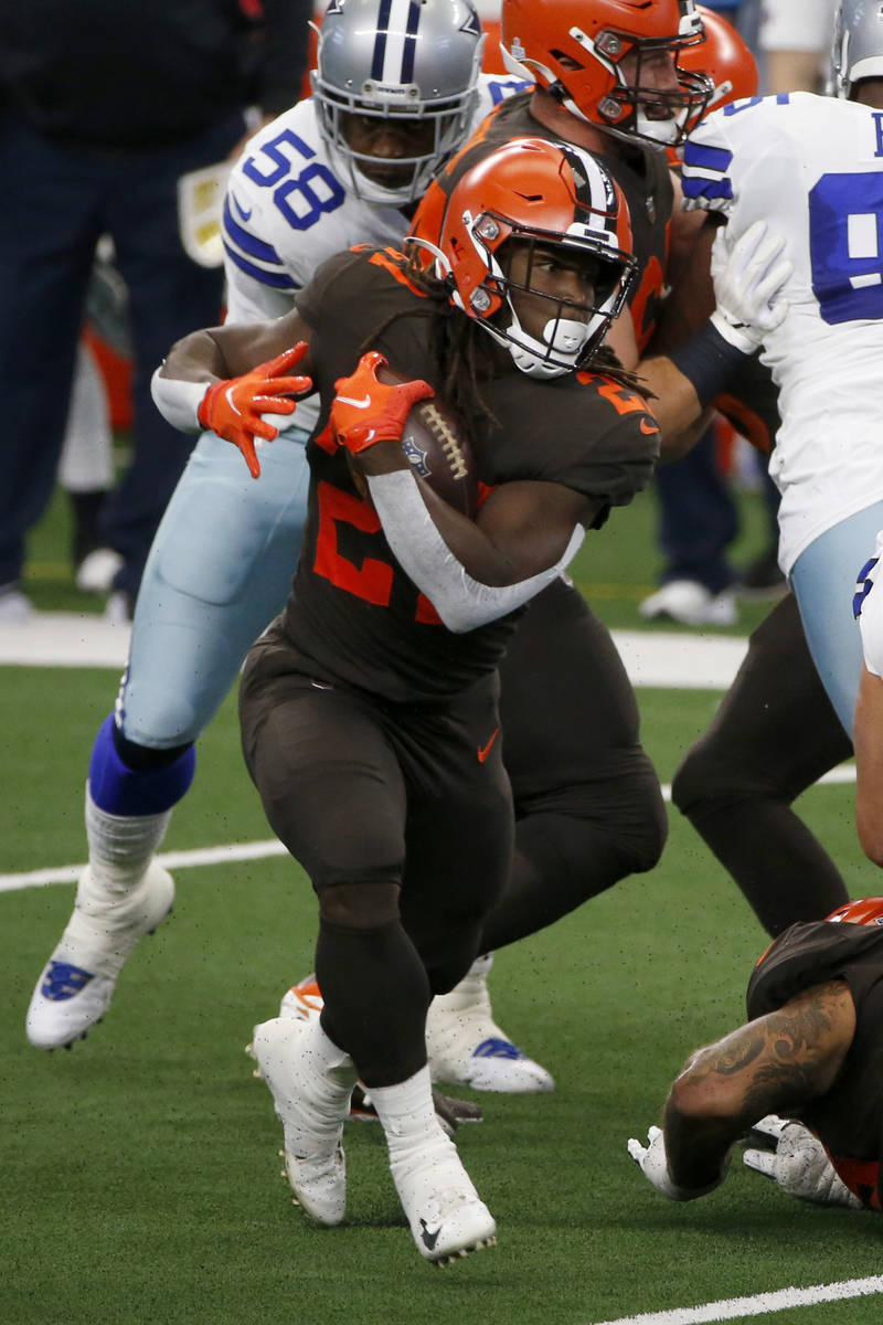 Cleveland Browns running back Kareem Hunt (27) rushes against the Dallas Cowboys during an NFL ...