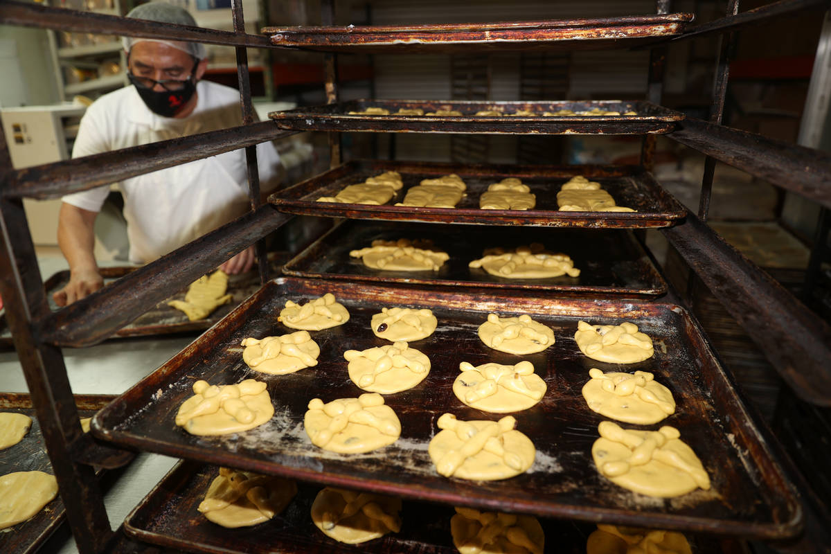 Pan de Muerto, Day of the Dead bread, is prepared for the oven at La Mexicana Bakery in Las Veg ...