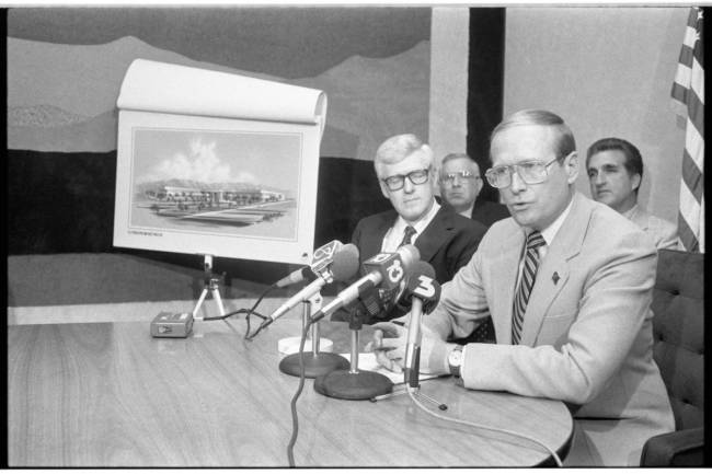 Gov, Richard Bryan speaks at a press conference with a rendering of a Citibank building in 1987 ...