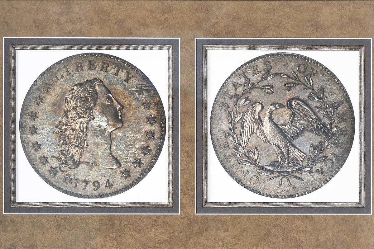 A framed photograph showing the front and back of rare coin collector Bruce Morelan's 1794 silv ...