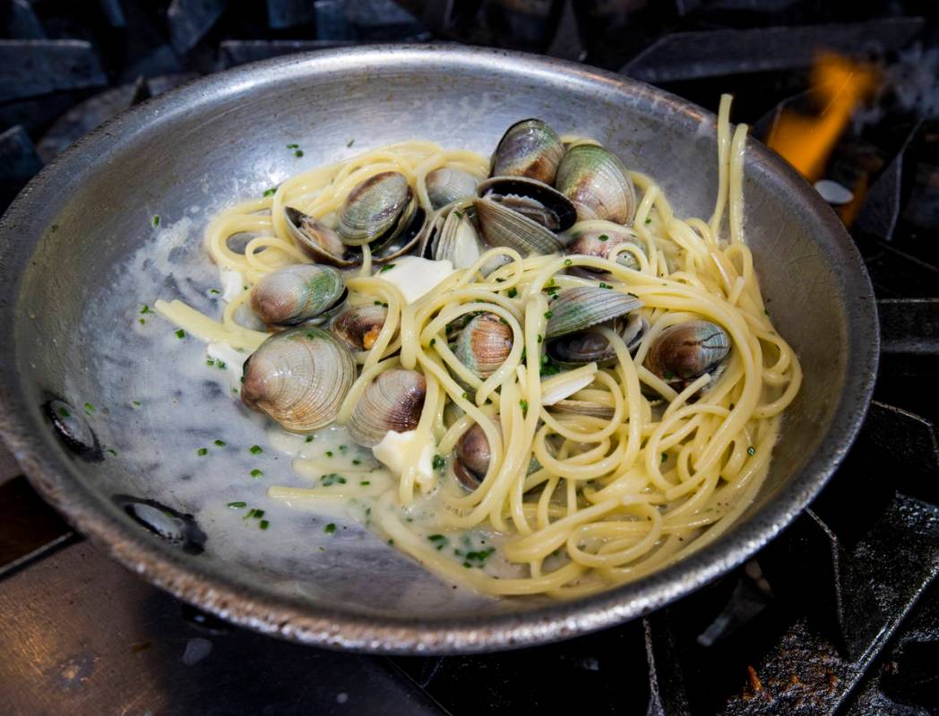 Executive chef Gina Marinelli prepares Spaghetti alle Vongole at La Strega in Summerlin. (L.E. ...