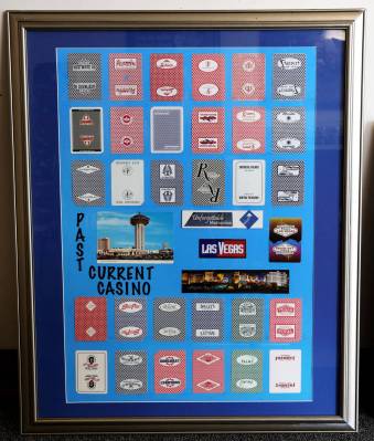 A framed collection of boxes of historic casino playing cards is for sale at Gamblers General S ...