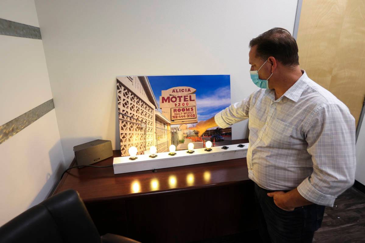 Keith Kochan, account executive at Vision Sign Inc., points to a picture of one of the former A ...