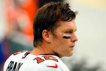 Tampa Bay Buccaneers quarterback Tom Brady (12) stands on the sidelines during warmups prior to ...