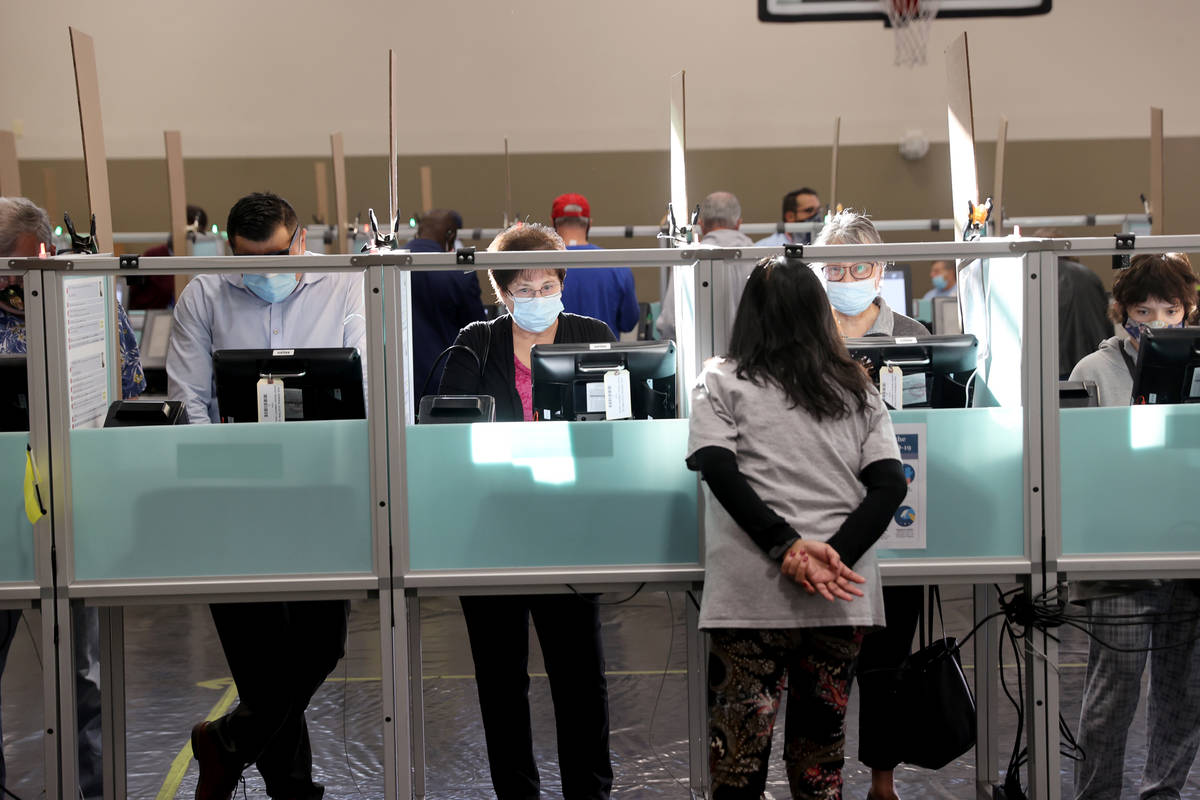 Voters, including from right, Isabel Perez, Marietta Navarro and Diane Stein cast their ballots ...