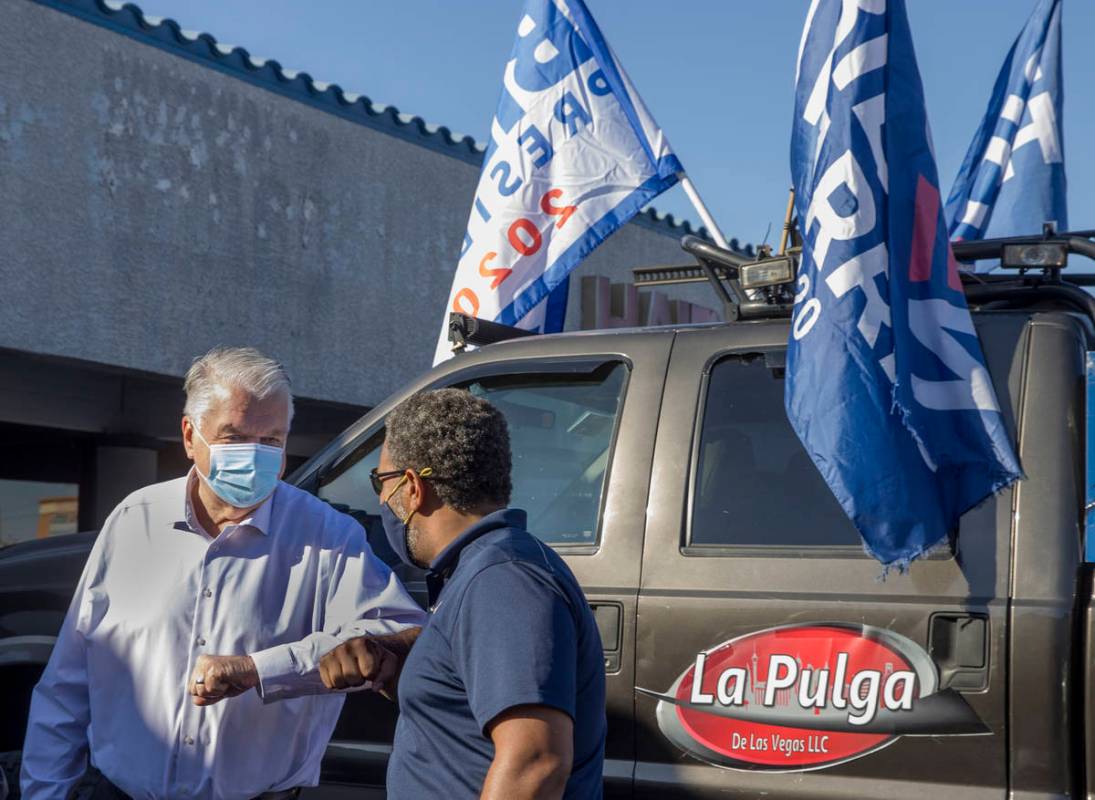 Gov. Steve Sisolak, left, greets NevadaÕs 4th Congressional District Rep. Steven Horsford ...