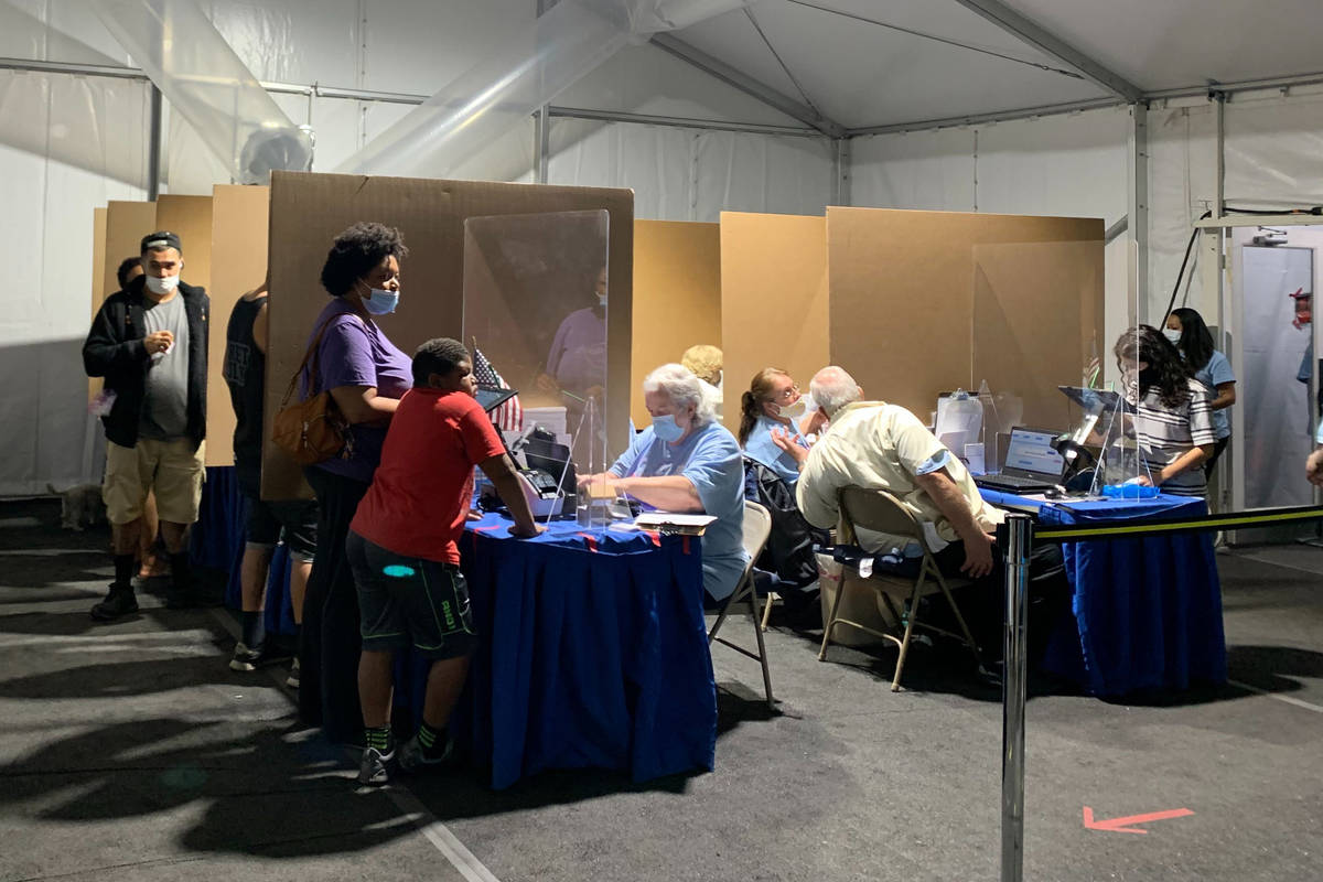 People line up to vote at the polling station on Eastern Avenue in Las Vegas, Tuesday, Nov. 3, ...