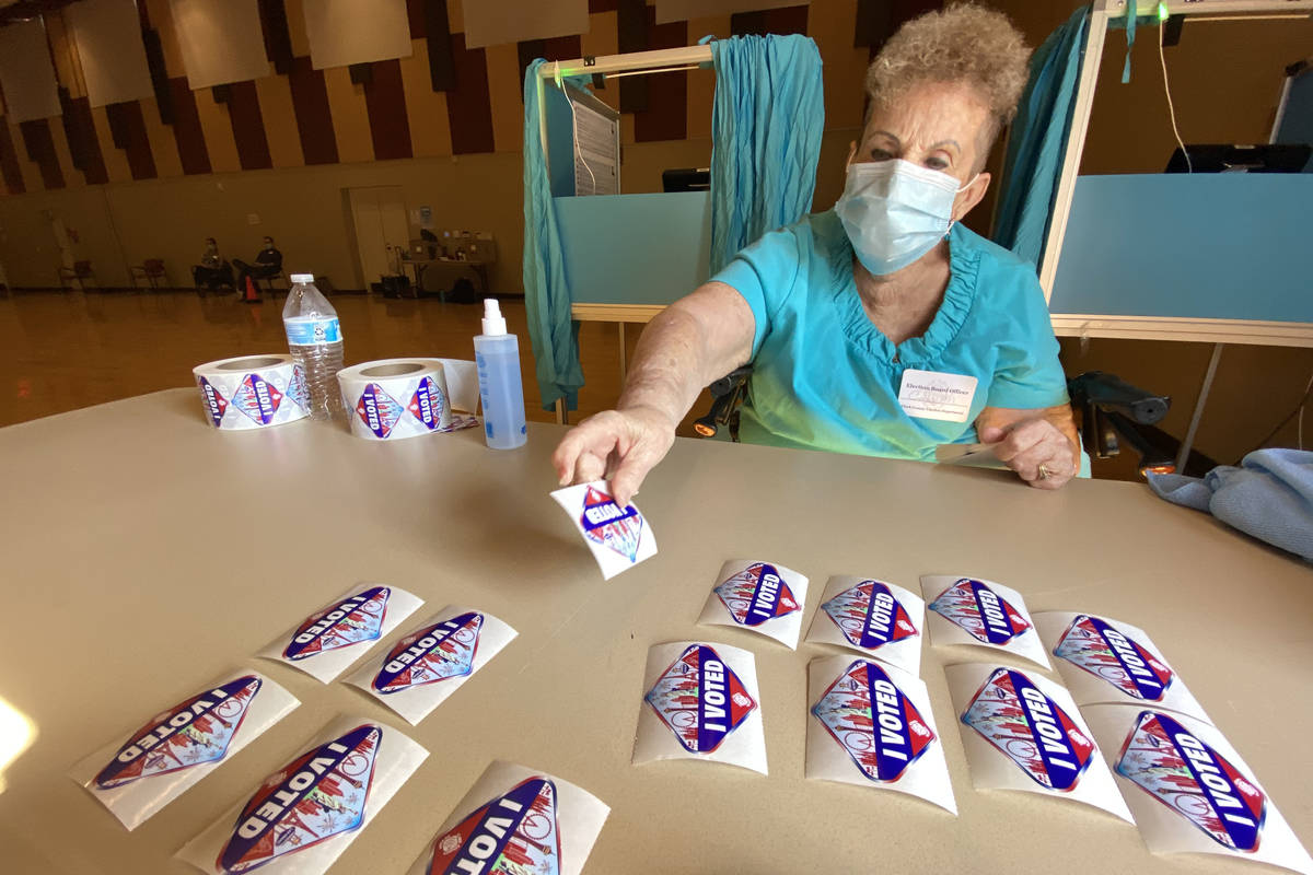 Connie Marshall, 77, prepares to pass out “I Voted” stickers at Historic Fifth St ...