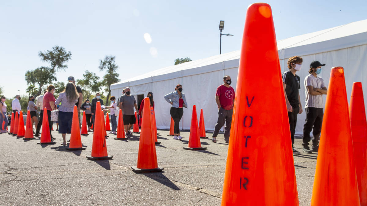 Voters await in line for their turns at the Meadows Mall vote center location during Election D ...