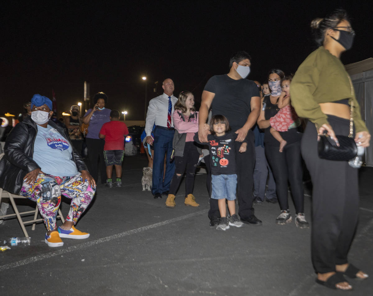 People wait in line to cast their ballot at the Boulevard Mall polling station an hour within c ...