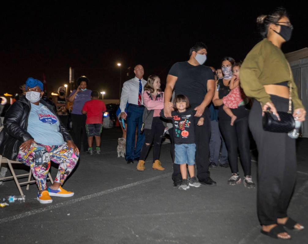 People wait in line to cast their ballot at the Boulevard Mall polling station an hour within c ...