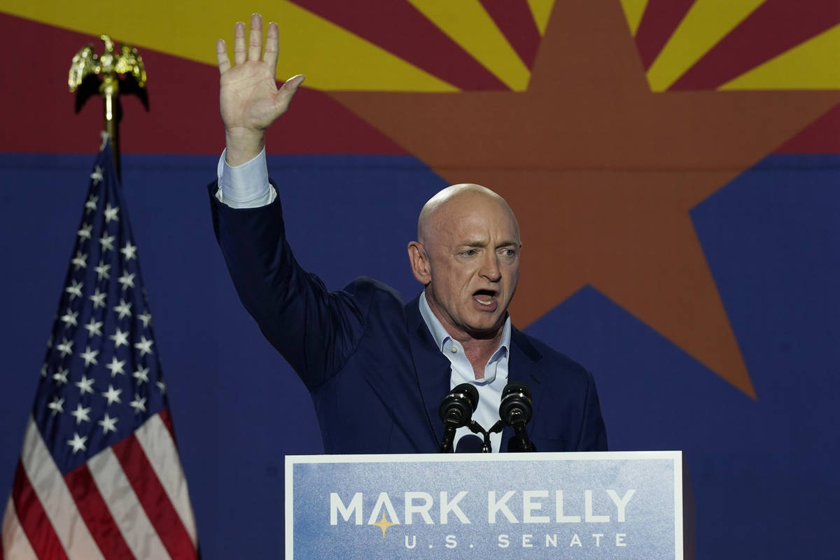 Mark Kelly, Arizona Democratic candidate for U.S. Senate, waves to supporters as he speaks duri ...