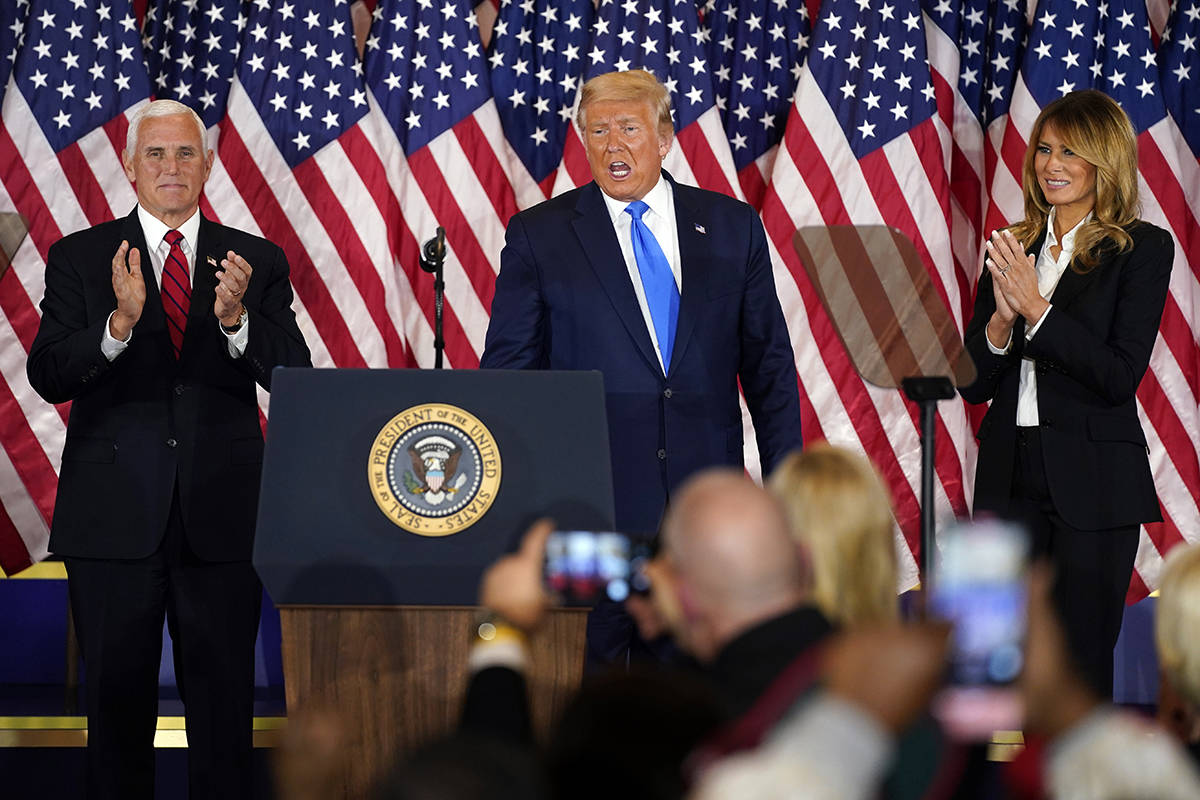 Vice President Mike Pence and first lady Melania Trump applaud after President Donald Trump spo ...