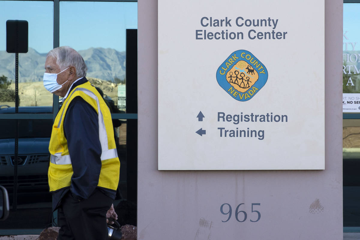 A security guard stands outside of the Clark County Election Center on Wednesday, Nov. 4, 2020, ...