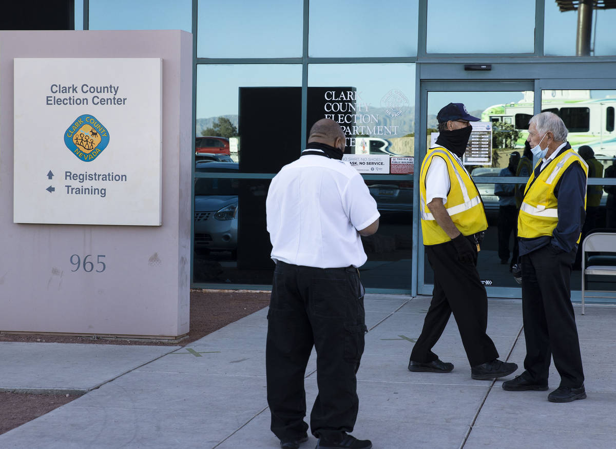 Security guards stand outside of the Clark County Election Center on Wednesday, Nov. 4, 2020, i ...