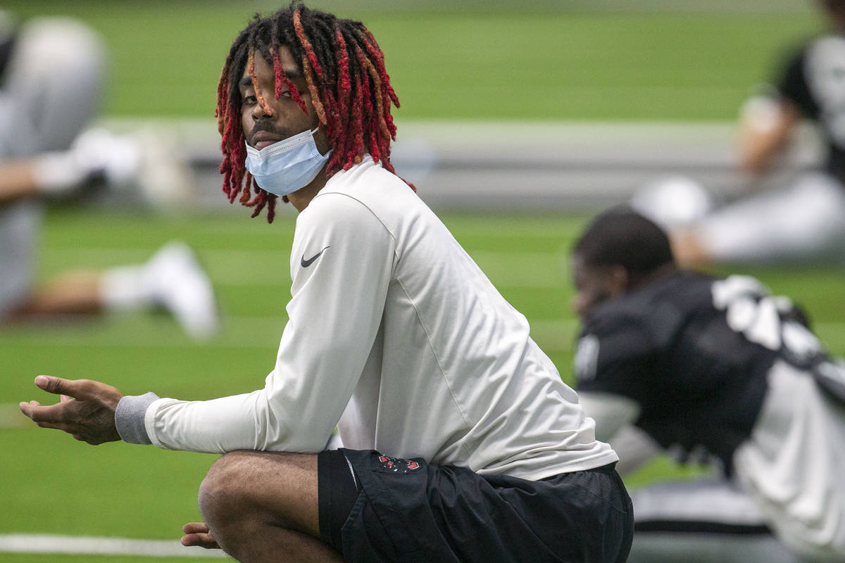 Las Vegas Raiders cornerback Damon Arnette looks on as the team stretches at the Intermountain ...