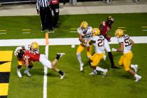 Maryland running back Jake Funk (34) dives in for a touchdown against Minnesota defensive back ...