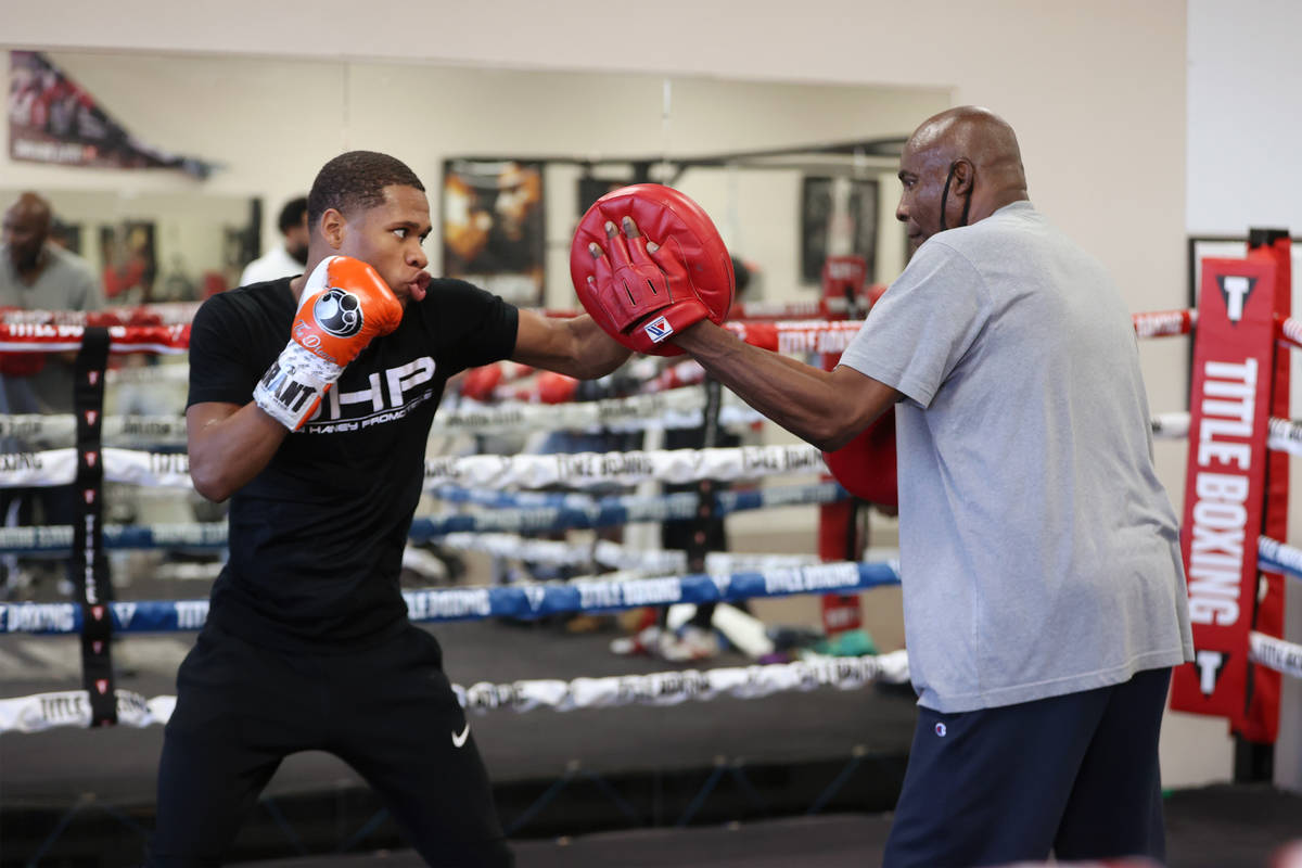 Boxer Devin Haney trains in the ring with Mike McCallum during a boxing gym workout at Title Bo ...