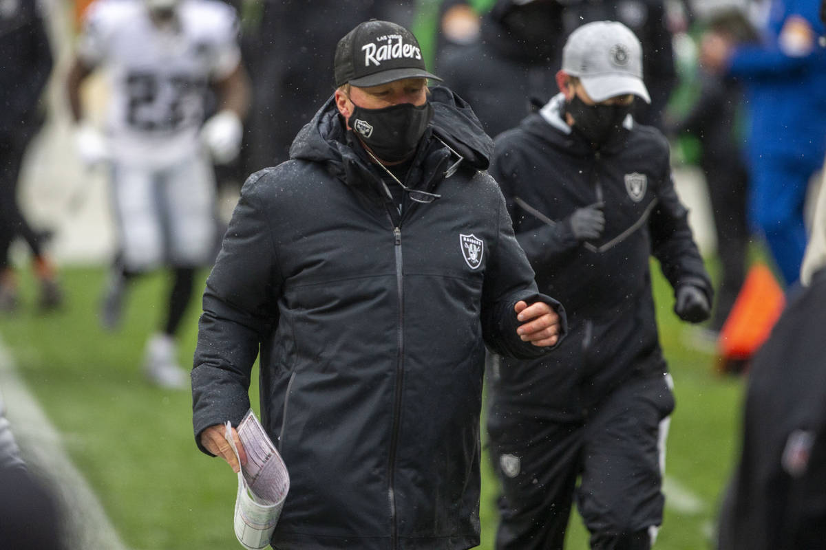 Las Vegas Raiders head coach Jon Gruden runs off the field for halftime during an NFL football ...