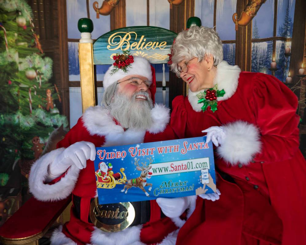 Chris Groeschke, 64, left, and Nancy Jean Gray, 72, as "Santa Kris Kringle" and Mrs. Claus, are ...