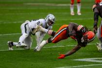Las Vegas Raiders strong safety Johnathan Abram (24) tackes Cleveland Browns running back Karee ...