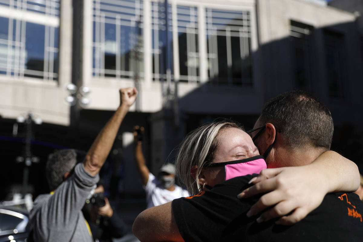 People celebrate outside the Pennsylvania Convention Center after Democrat Joe Biden defeated P ...