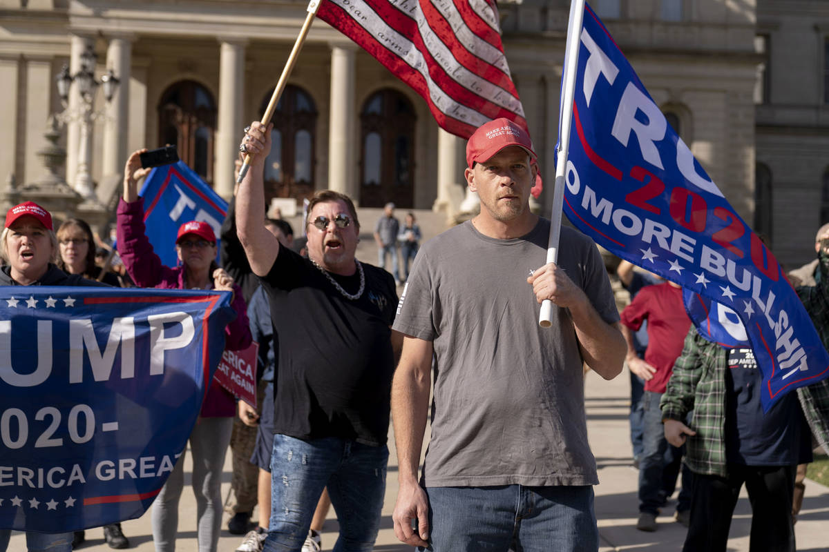 Trump supporters demonstrating the election results face off with counter protesters at the Sta ...