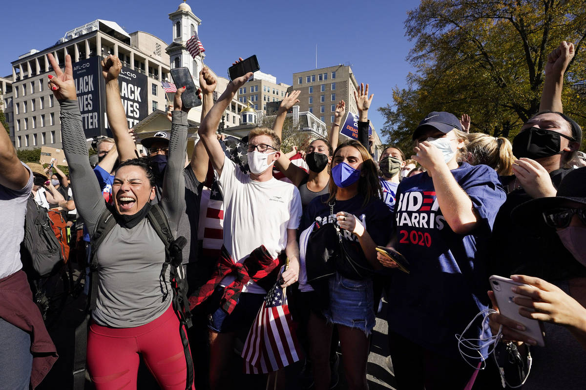 People gathered in Black Lives Matter Plaza react to the presidential race being called for Dem ...