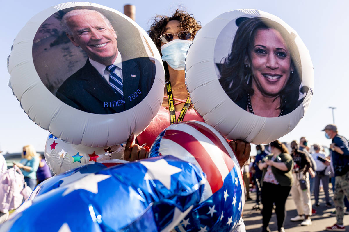 Supporters of President-elect Joe Biden congregate in a parking lot near the Chase Center where ...