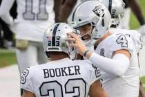 Las Vegas Raiders quarterback Derek Carr (4) celebrates a touchdown run by Las Vegas Raiders ru ...