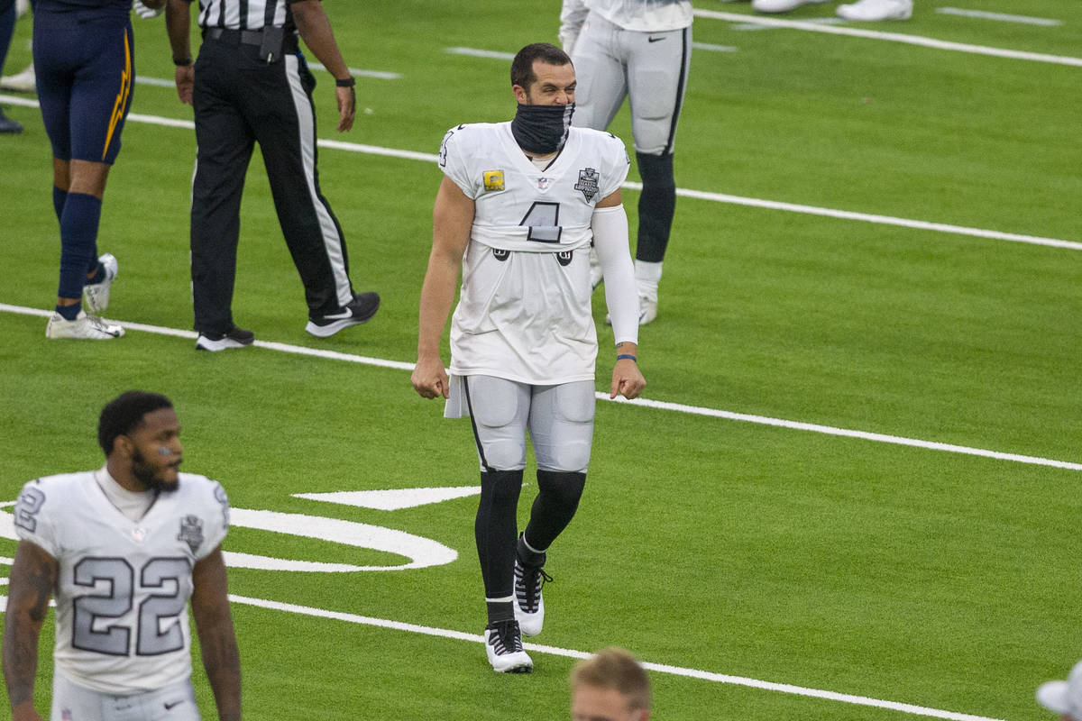 Las Vegas Raiders quarterback Derek Carr (4) reacts after seeing a replay of a Los Angeles Char ...