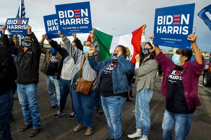 Attendees gather and sing before a car parade down the Las Vegas Strip to celebrate former Vice ...