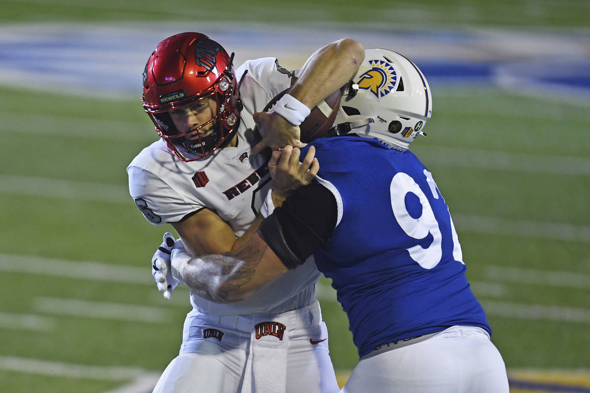 San Jose State's Cade Hall (92) tackles UNLV quarterback Max Gilliam, left, during the first qu ...