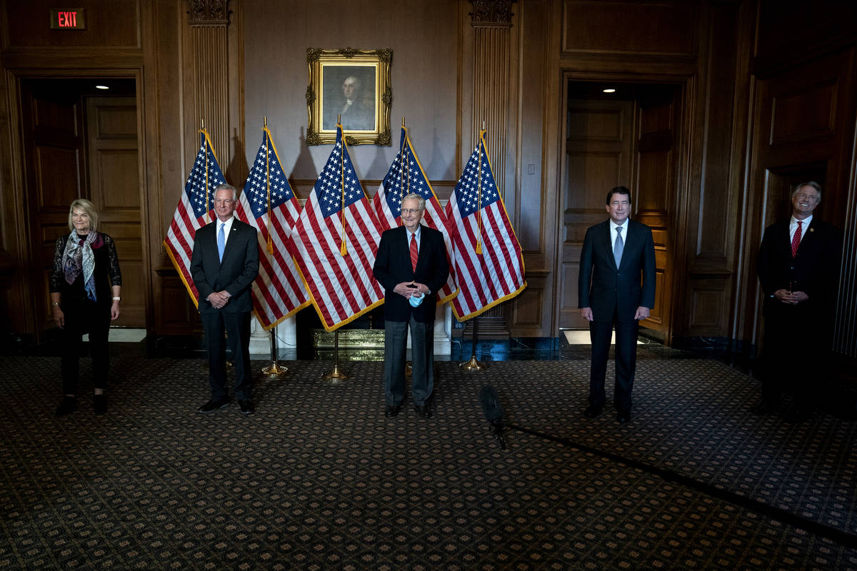 Senate Majority Leader Mitch McConnell of Ky., poses with newly elected Republican senators, ...