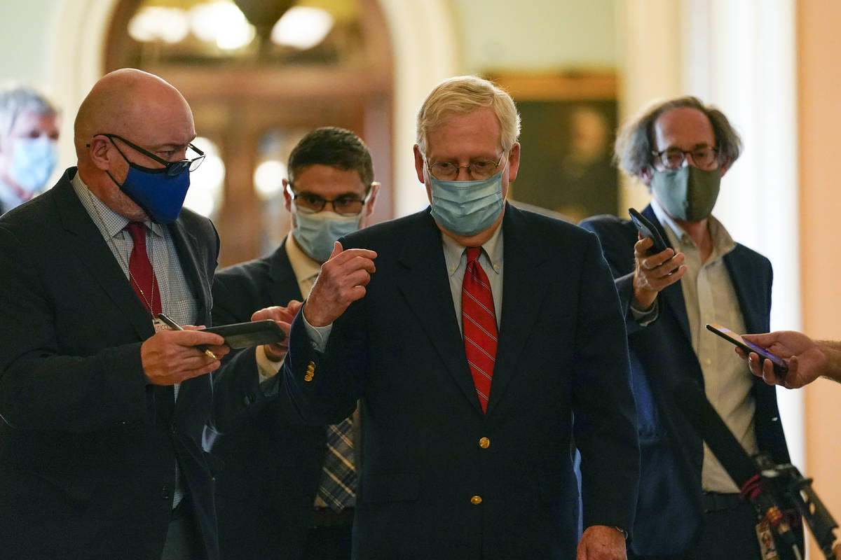 Senate Majority Leader Mitch McConnell of Ky., talks with reporters after he spoke on the Senat ...