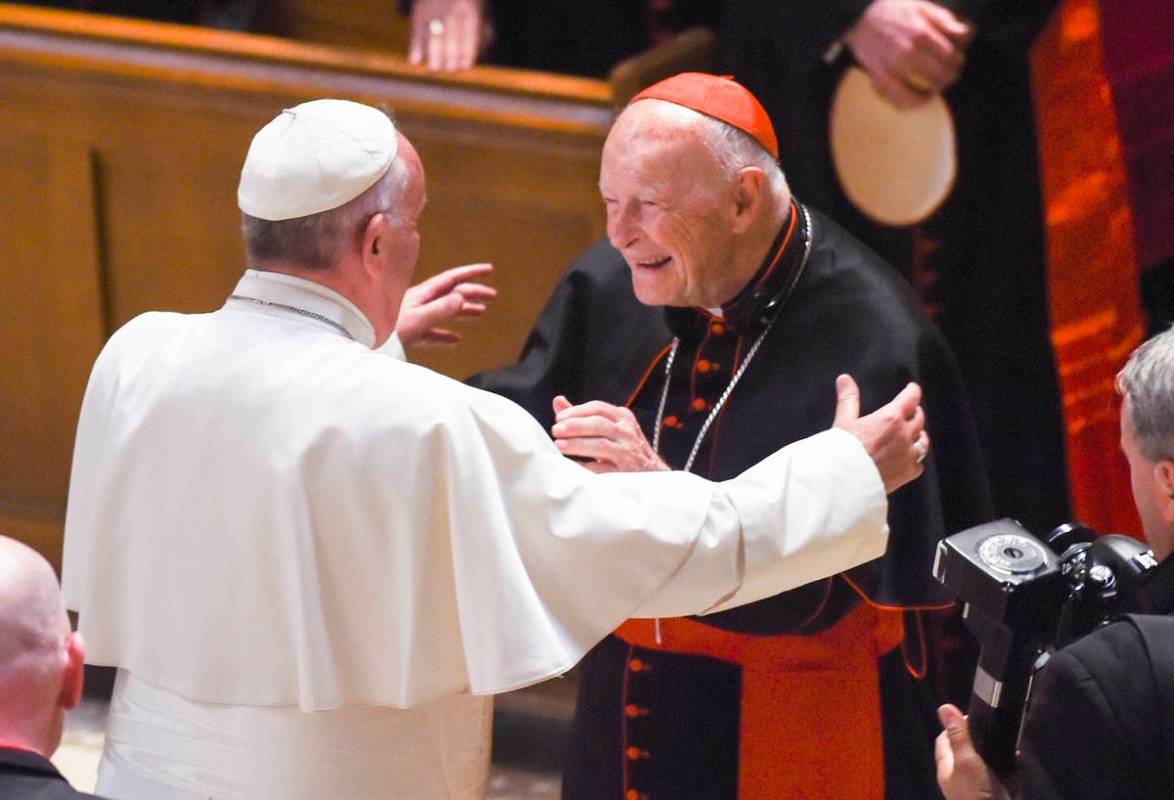 In this Sept. 23, 2015, file photo, Pope Francis reaches out to hug Cardinal Archbishop emeritu ...