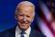 President-elect Joe Biden pauses as listens to media questions at The Queen theater, Tuesday, N ...