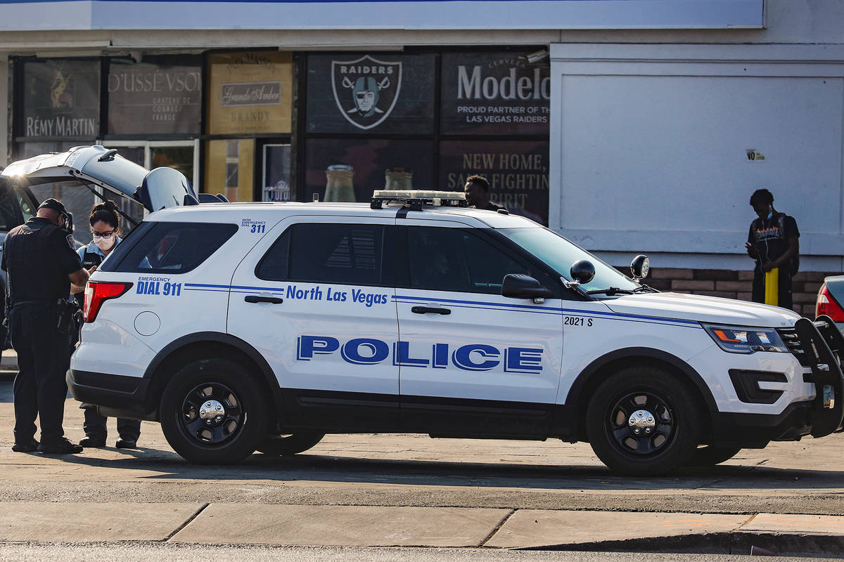 North Las Vegas police officers work the scene of a homicide where a man was fatally shot Sunda ...