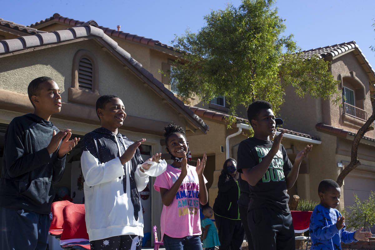 Members of the Burton-Watkins and Moffatt families, who live across the street from Las Vegan L ...