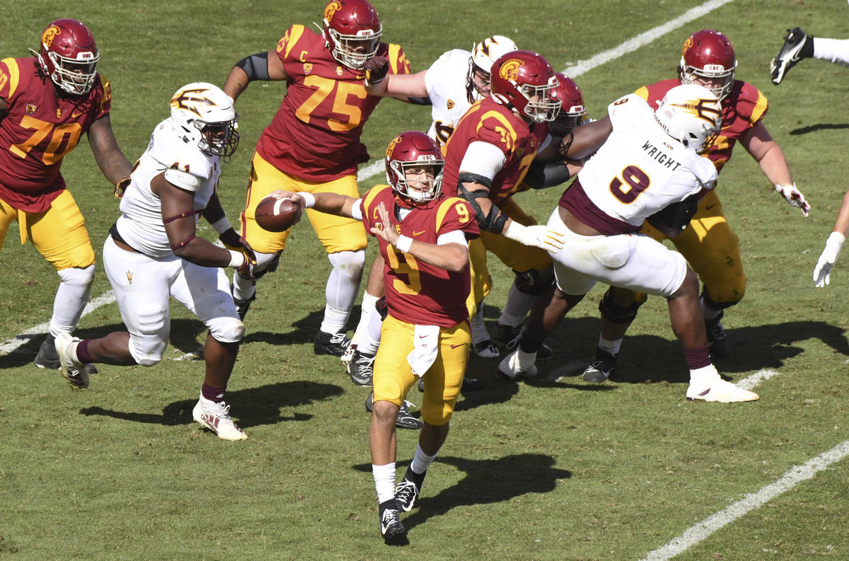 Quarterback Kedon Slovis #9 of the USC Trojans passes against the Arizona State Sun Devils in t ...