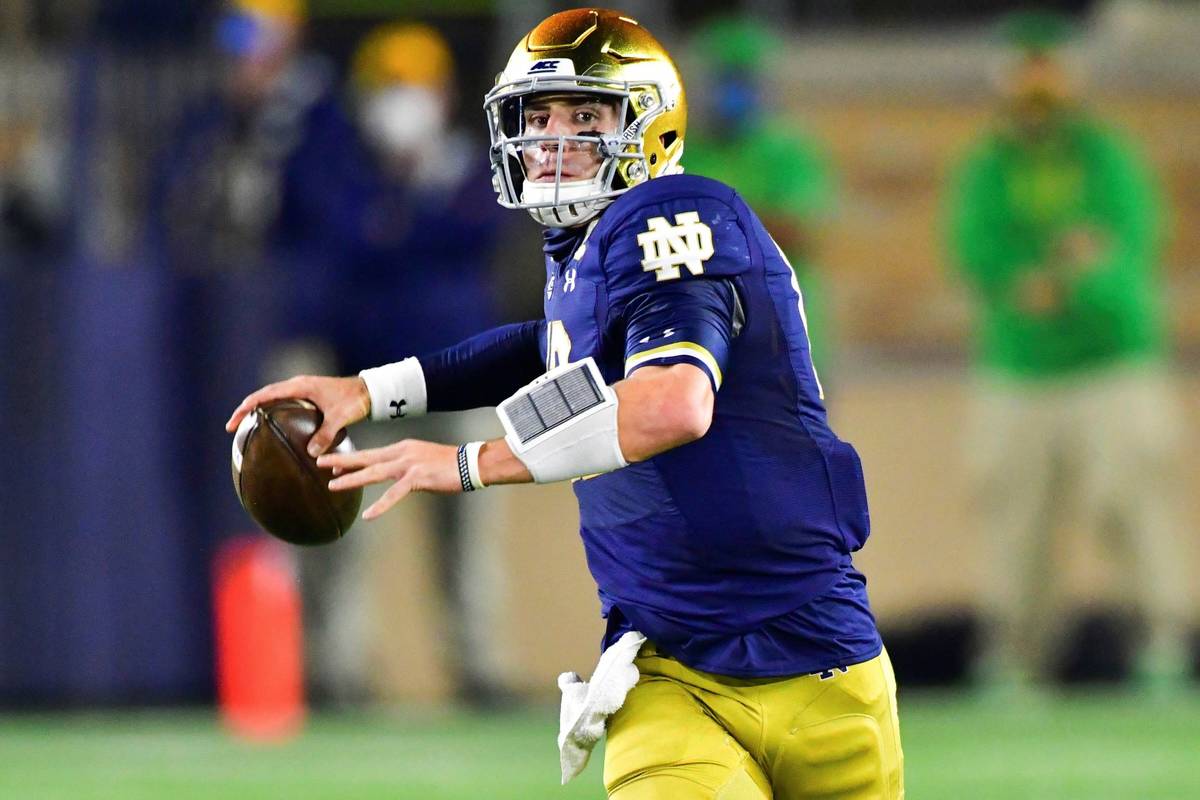 Notre Dame quarterback Ian Book looks for a receiver during the first quarter against Clemson i ...