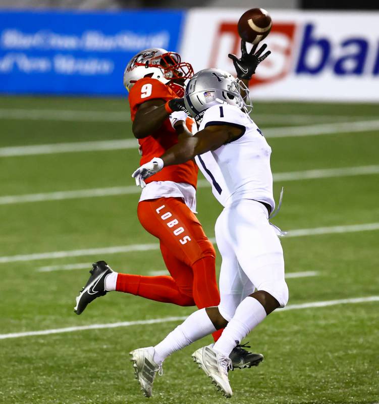 New Mexico Lobos safety Jerrick Reed II (9) intercepts a pass intended for UNR Wolf Pack wide r ...